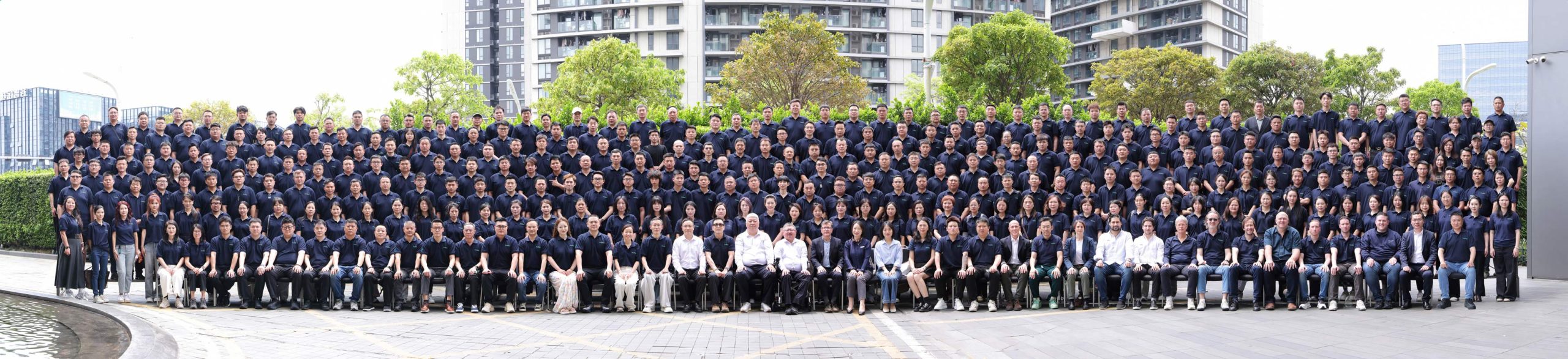Large group photo of Profilm staff and partners gathered outdoors at the company's 2026 global conference